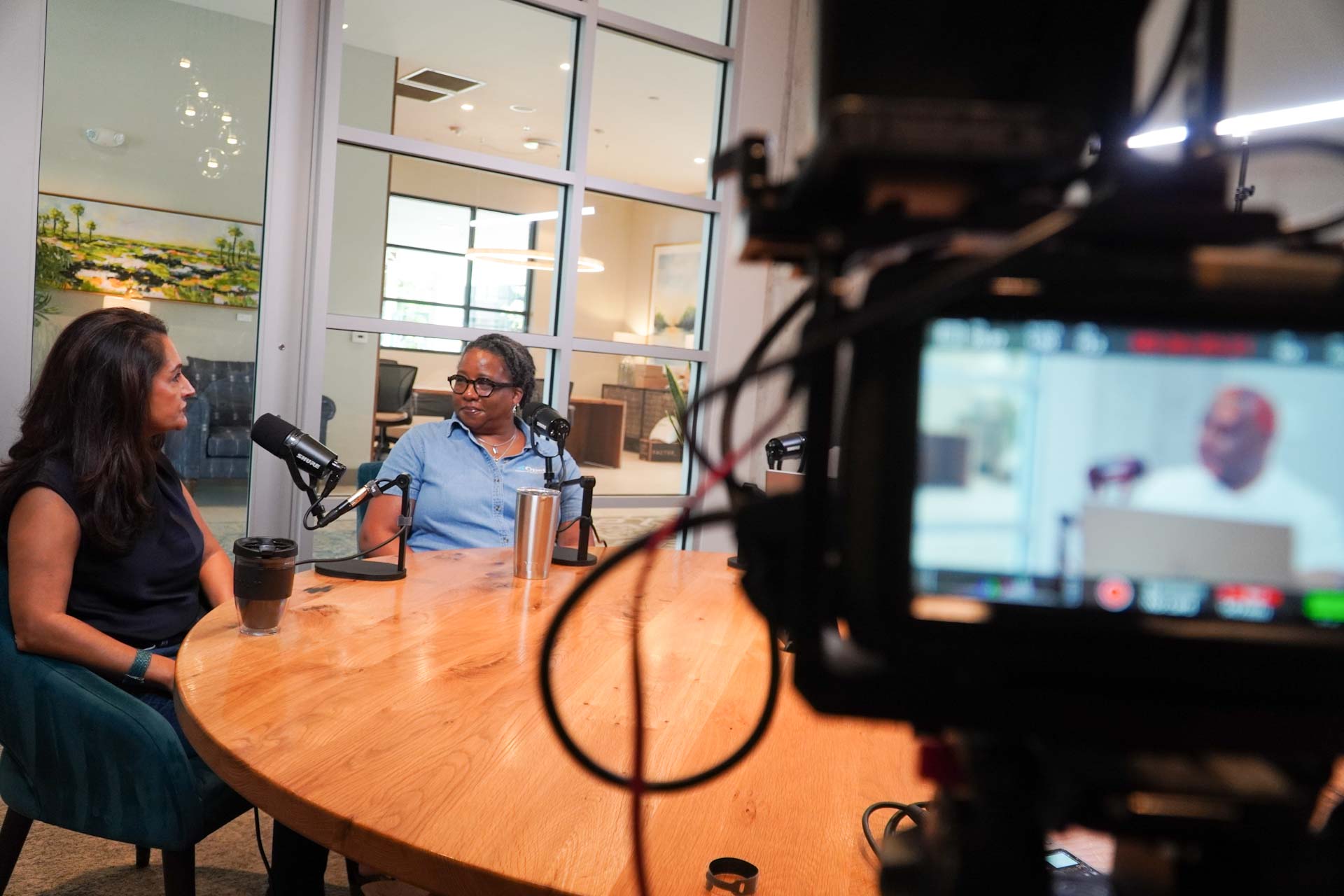 Podcast Titans recording a professional business conversation in Charlotte